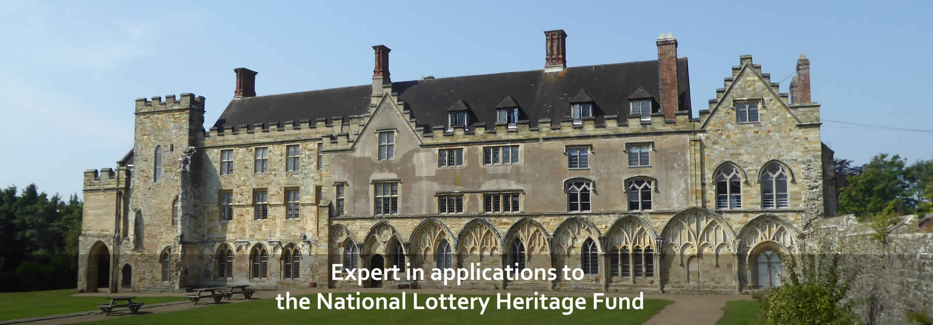 Expert in applications to the National Lottery Heritage Fund - back drop Hastings Abbey